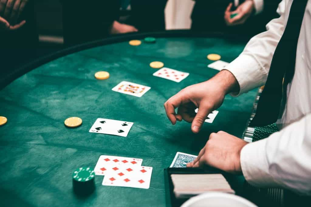 A croupier deals cards and chips in a casino.