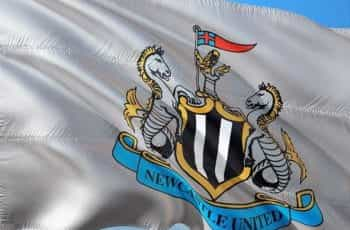 A white flag with the Newcastle United football club crest.