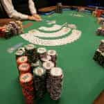 World Series of Poker Chips stacked high on a poker table.