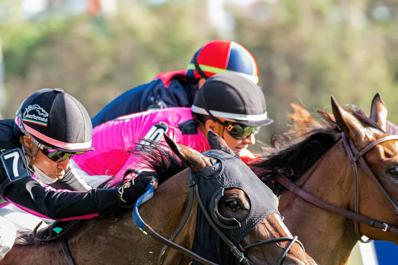 Jockeys racing horses.