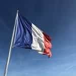 French flag blowing in the wind.