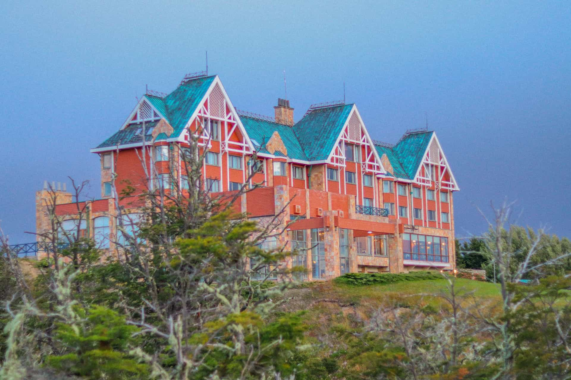 An orange and blue hotel in Puerto Natales, Chile.