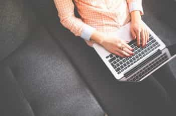 A woman using a laptop.